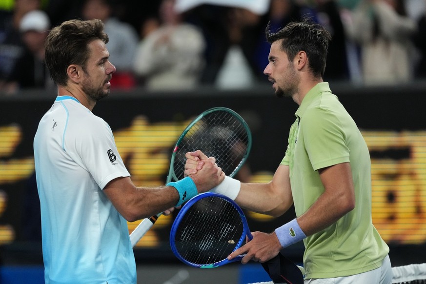 Stan Wawrinka, left, of Switzerland is congratulated by Arthur Gea of France following their second round match at the Australian Open tennis championship in Melbourne, Australia, Thursday, Jan. 22, 2 ...