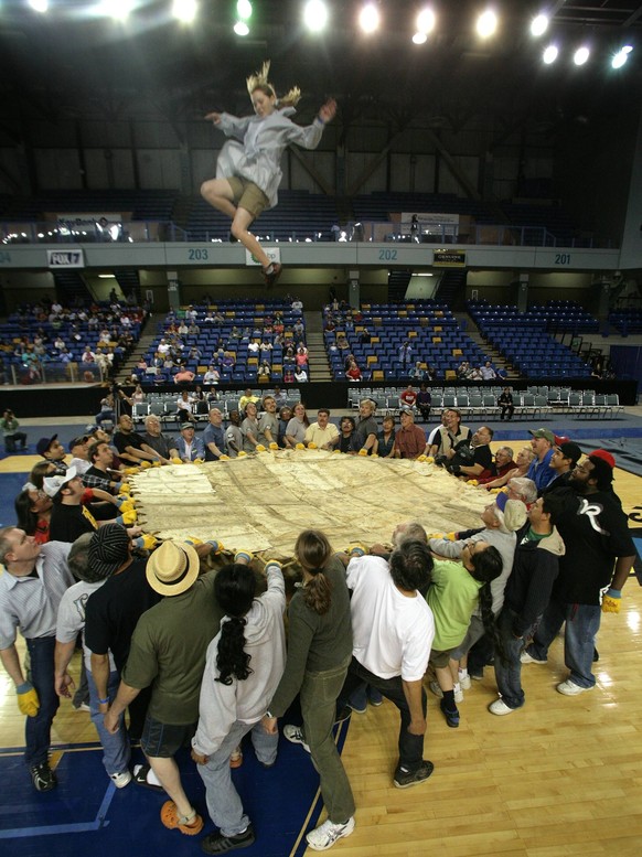 Sam Harrel/News-Miner.World Eskimo-Indian Olympics competitor Caitlyn Picket-Bowell soars through the air during the preliminary round of the Women Blanket Toss on Wednesday, July 15, 2009, at the Car ...