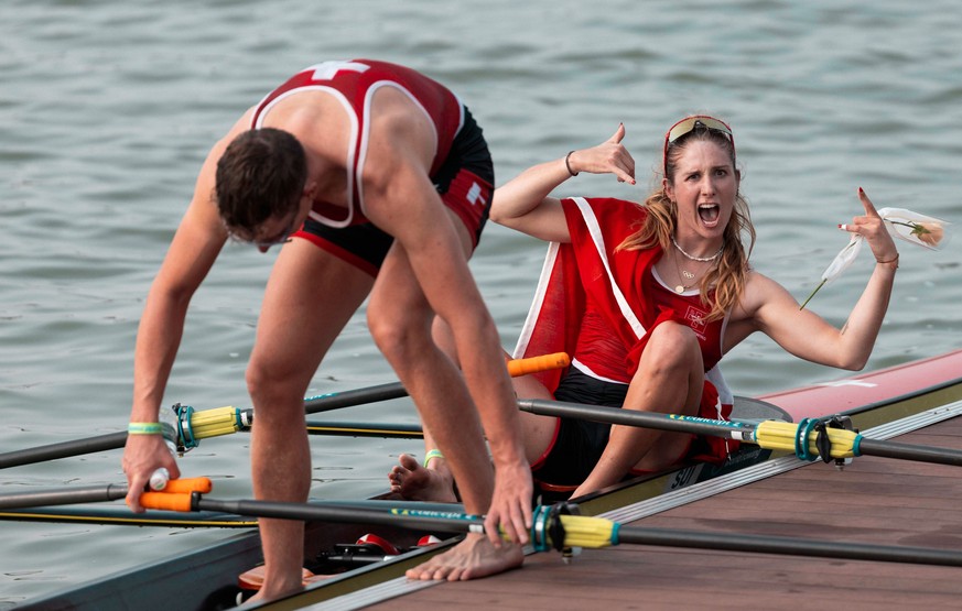 epa12412088 Swiss rowers Celia Dupre (R) and Raphael Ahumada celebrate winning bronze in the Mixed Double Sculls Final A at the World Rowing Championships in Shanghai, China, 28 September 2025. EPA/AL ...