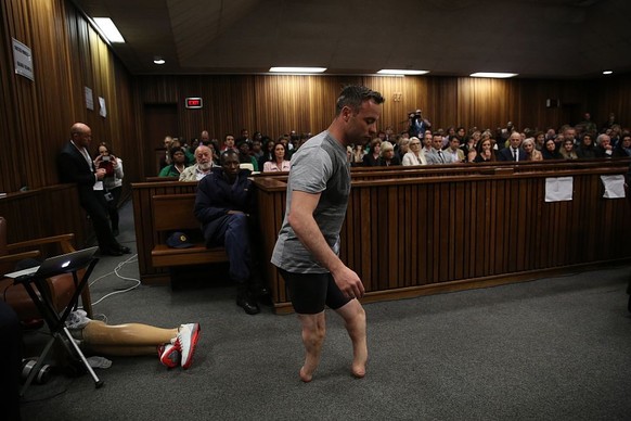 PRETORIA, SOUTH AFRICA - JUNE 15: Oscar Pistorius walks across the courtroom without his prosthetic legs during the third day of Oscar&#039;s hearing for a resentence at Pretoria High Court on June 15 ...