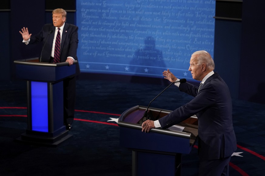 FILE - President Donald Trump and Democratic presidential candidate former Vice President Joe Biden exchange points during their first presidential debate at Case Western University and Cleveland Clin ...