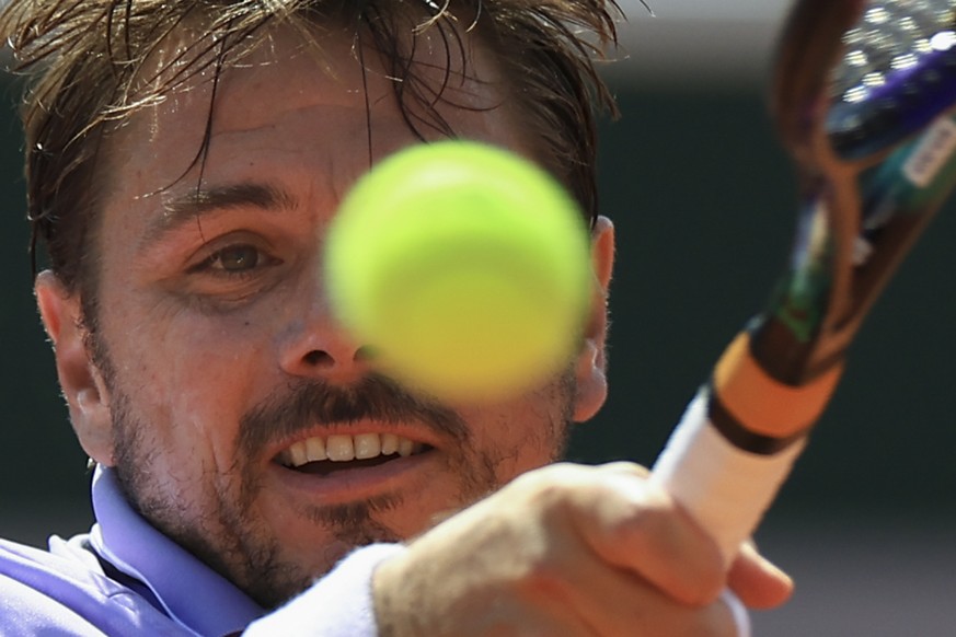 Switzerland&#039;s Stan Wawrinka plays a shot against Spain&#039;s Albert Ramos-Vinolas during their first round match of the French Open tennis tournament at the Roland Garros stadium in Paris, Monda ...