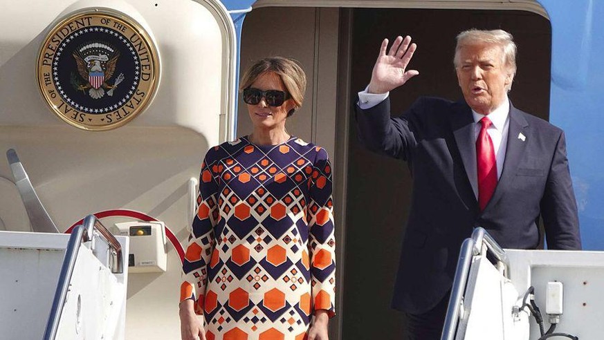 President Donald Trump waves to a handful of supporters as he arrives with first lady Melania Trump at Palm Beach International Airport in West Palm Beach, Fla., Wednesday, Jan. 20, 2021. (Joe Cavaret ...