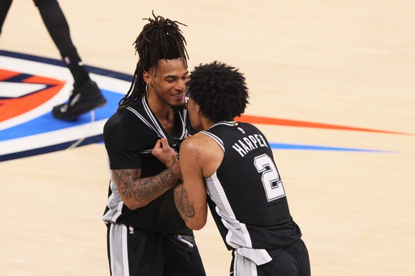 San Antonio Spurs guard Stephon Castle and guard Dylan Harper (2) celebrate in the second half of Game 7 of the Western Conference finals of the NBA basketball playoffs series against the Oklahoma Cit ...