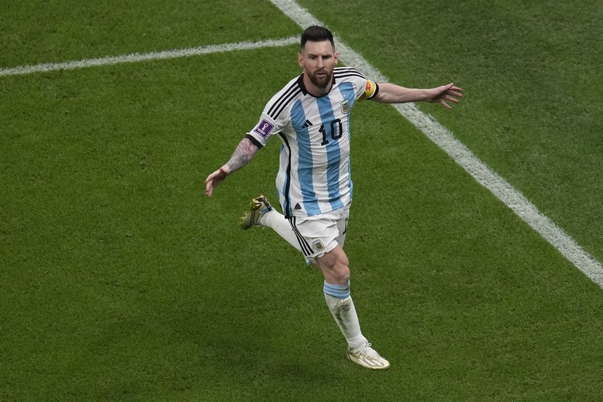 Argentina&#039;s Lionel Messi celebrates scoring his side&#039;s opening goal from the penalty spot during the World Cup semifinal soccer match between Argentina and Croatia at the Lusail Stadium in L ...