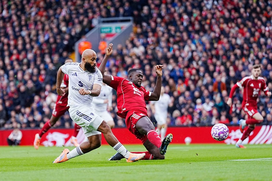 Manchester United&#039;s Bryan Mbeumo scores his side&#039;s first goal with Amad Diallo during the English Premier League soccer match between Liverpool and Manchester United in Liverpool, England, S ...