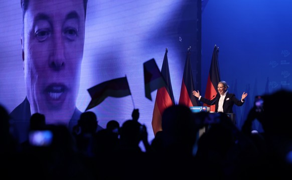 epa11852260 Alternative for Germany (AfD) party and faction co-chairwoman and top candidate for the federal election Alice Weidel talks online to Elon Musk during her speech during election campaign l ...