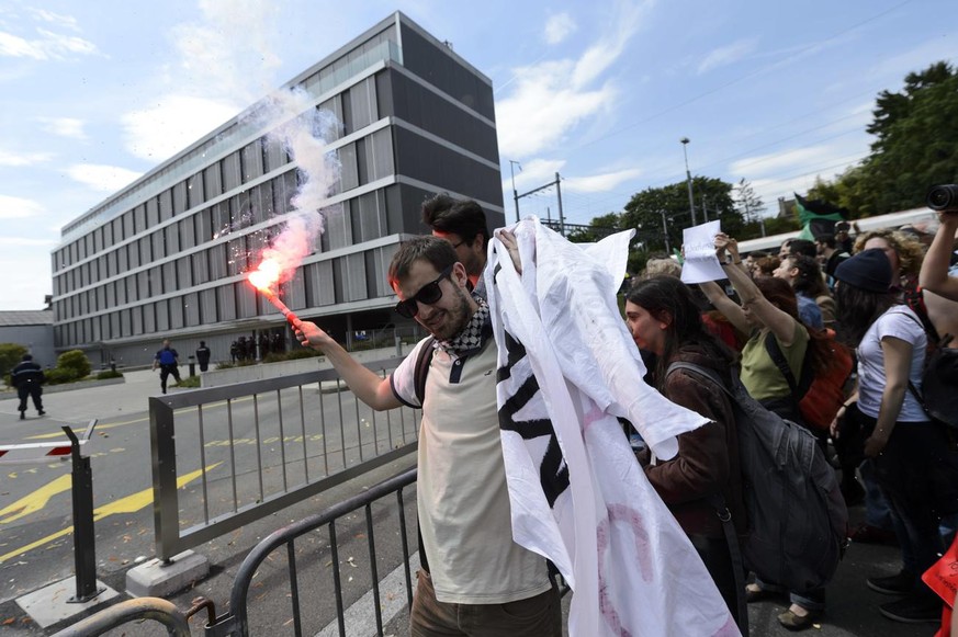 Social Activists demonstrate during a World March against Monsanto in front of the headquarter Europe-Middle East-Africa of the American multinational agrochemical and agricultural biotechnology, in M ...