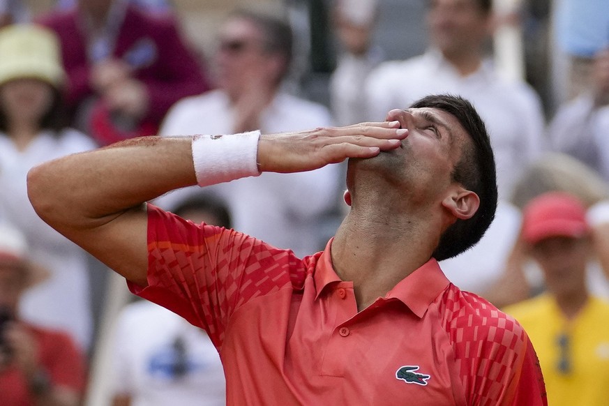 Serbia&#039;s Novak Djokovic celebrates winning the men&#039;s singles final match of the French Open tennis tournament against Norway&#039;s Casper Ruud in three sets, 7-6, (7-1), 6-3, 7-5, at the Ro ...