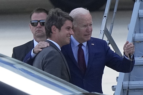 President Joe Biden hugs French Prime Minister Gabriel Attal upon his arrival Wednesday, June 5, 2024 at Orly airport, south of Paris. President Joe Biden will mark the 80th anniversary of the D-Day i ...