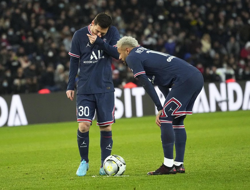 PSG&#039;s Lionel Messi, left, talks to PSG&#039;s Neymar before a free kick during the French League One soccer match between Paris Saint Germain and Saint-Etienne at the Parc des Princes stadium in  ...