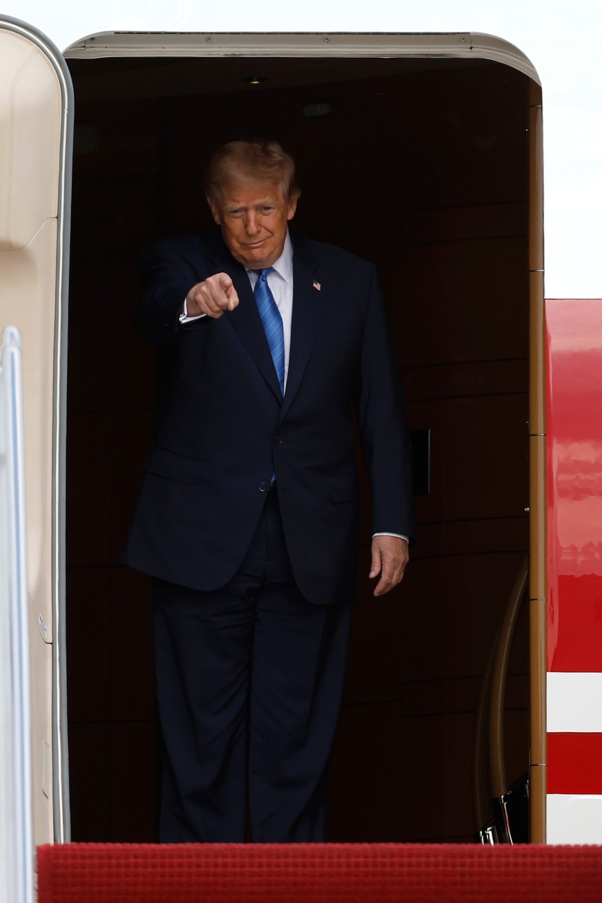 President Donald Trump gestures as he disembarks Air Force One upon his arrival at Joint Base Andrews, Md, Friday, Aug. 28, 2026. (AP Photo/Luis M. Alvarez)
Donald Trump
