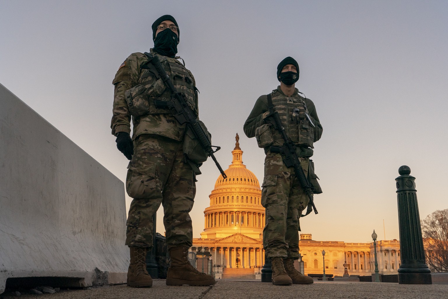 National Guard stand their posts around the Capitol at sunrise in Washington, Monday, March 8, 2021. (AP Photo/Carolyn Kaster)