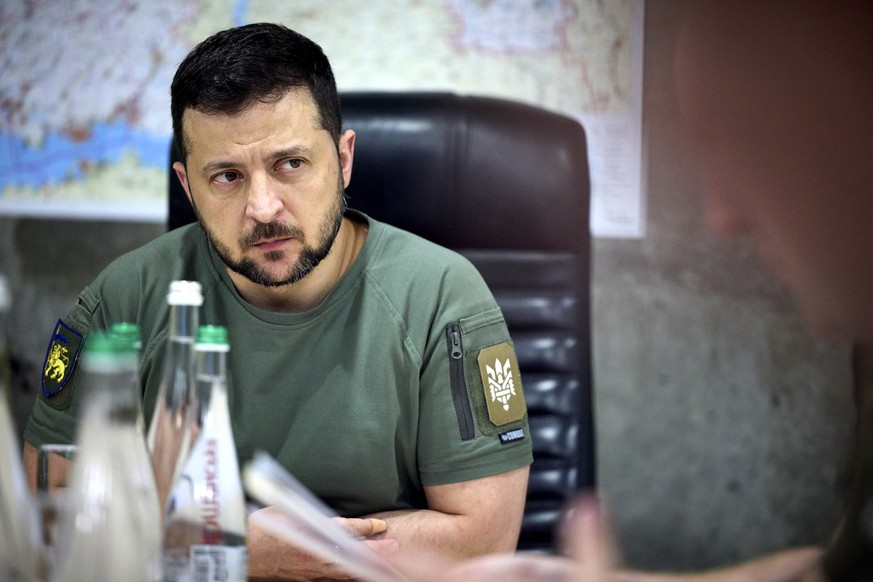 epa10059689 A handout photo made available by the Ukrainian presidential press service shows Ukrainian President Volodymyr Zelensky meets with local officials in the Dnipropetrovsk area, Ukraine, 08 J ...