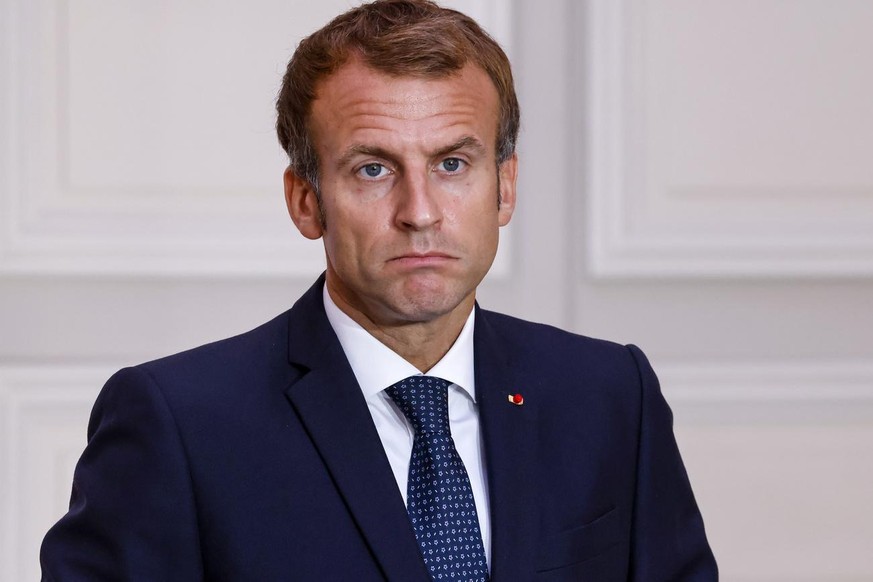 epa09492471 French President Emmanuel Macron gives a press conference with Greek Prime Minister during a signing ceremony of a new defence deal at The Elysee Palace in Paris, France, 28 September 2021 ...