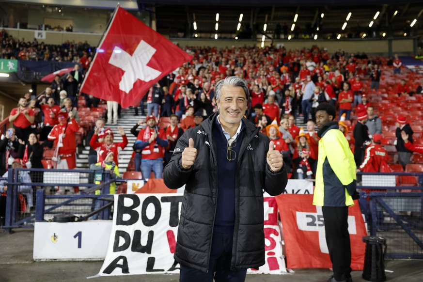 Switzerland's head coach Murat Yakin cheers in front of Switzerland supporters before the UEFA Nations League soccer match between Scotland and Switzerland at the Hampden Park in Glasgow, Scotlan ...