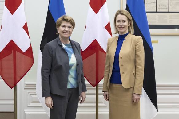 Swiss Federal President Viola Amherd, left, and Estonia&#039;s Prime Minister Kaja Kallas, pose in front of the flags at the Stenbock House, the government office of Estonia, during an official visit  ...