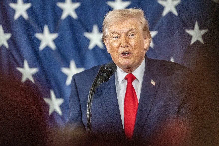 epa12736474 US President Donald Trump delivers remarks to service members and their families at Fort Bragg, North Carolina, USA, 13 February 2026. Trump met with US special forces members involved in  ...