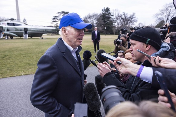 epa10451533 US President Joe Biden speaks with the media upon his return to the White House from Camp David in Washington, DC, USA, 06 February 2023. The president will deliver his State of the Union  ...
