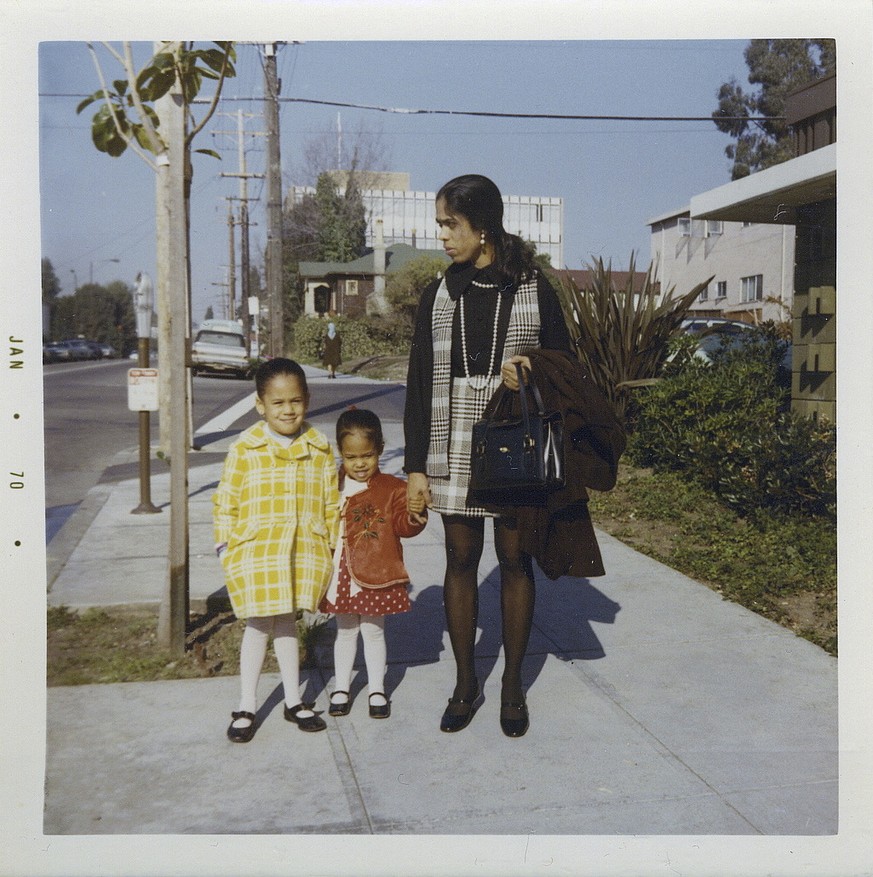 This January 1970 photo provided by the Kamala Harris campaign shows her, left, with her sister, Maya, and mother, Shyamala, outside their apartment in Berkeley, Calif., after her parents&amp;#039; se ...