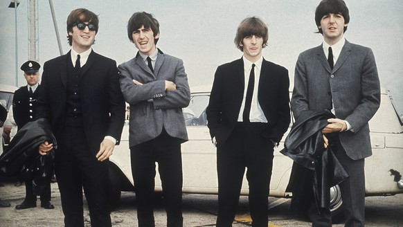 FILE - The Beatles, from left, John Lennon, George Harrison, Ringo Starr and Paul McCartney arrive in Liverpool, England on July 10, 1964, for the premiere of their movie "A Hard Day's Night ...