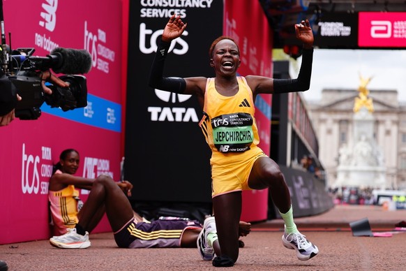 epa11291362 Kenya's Peres Jepchirchir reacts after finishing first in the women's race of the London Marathon and breaks the women's-only world record in London, Britain, 21 Apr 2024. T ...