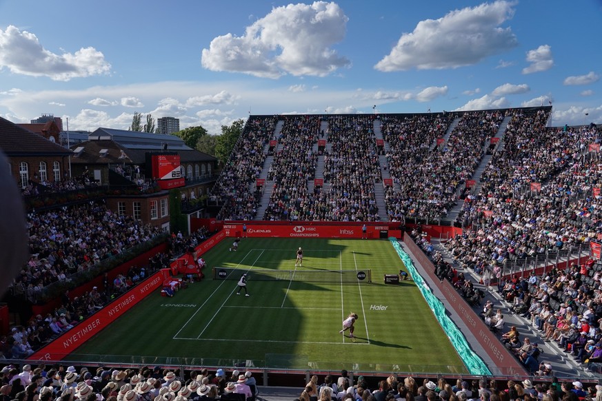 Serena Williams of the United States, bottom right, attempts to reach a return as she and playing partner Victoria Mboko of Canada play against Nicole Melichar-Martinez of Canada and Erin Routliffe of ...