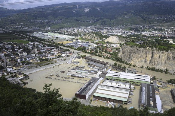 A view of the Rhone river, at right, and the Navizence river, following the storms that caused major flooding, in Chippis, Switzerland, Sunday, June 30, 2024. The Rhone river burst its banks in severa ...