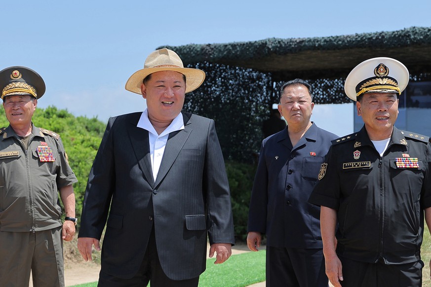 In this photo provided by the North Korean government, its leader Kim Jong Un, second left, supervises tests of a destroyer, the Kang Kons main gun and automatic cannons at an undisclosed place in No ...