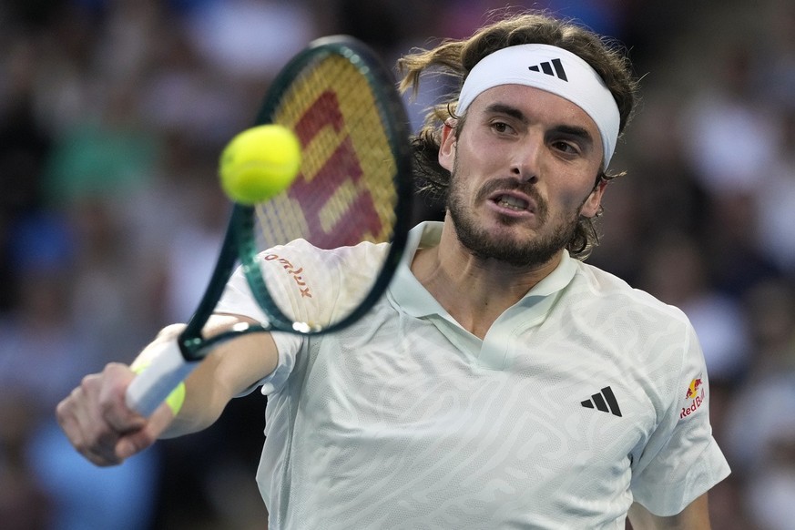 Stefanos Tsitsipas of Greece plays a backhand return to Jordan Thompson of Australia during their second round match at the Australian Open tennis championships at Melbourne Park, Melbourne, Australia ...