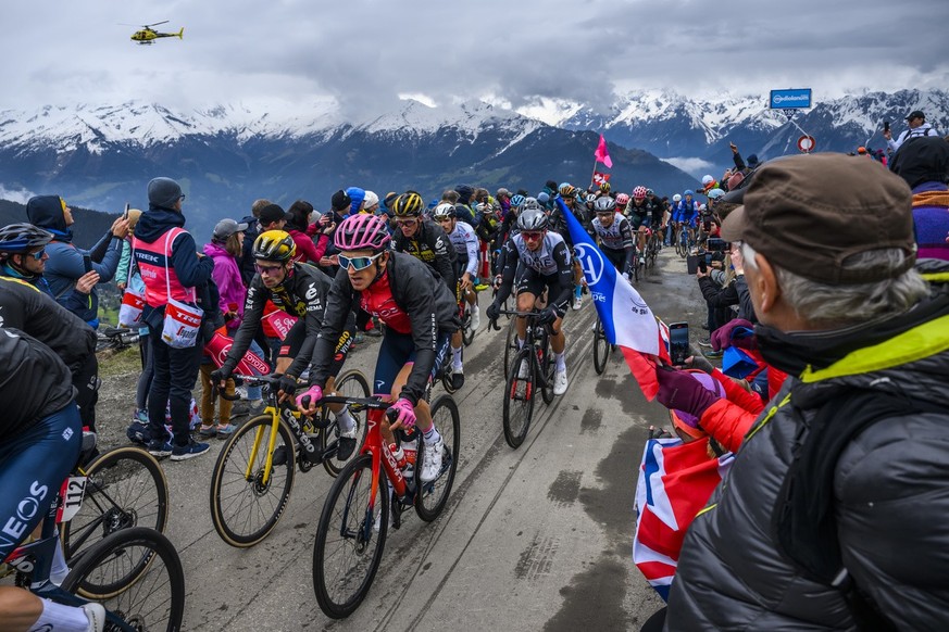 Primoz Roglic from Slovenia of team Jumbo-Visma, left, and Overall leader Geraint Thomas from Great Britain of team Ineos Grenadiers, right, climb up the Croix de Coeur pass during the 13th stage a 74 ...