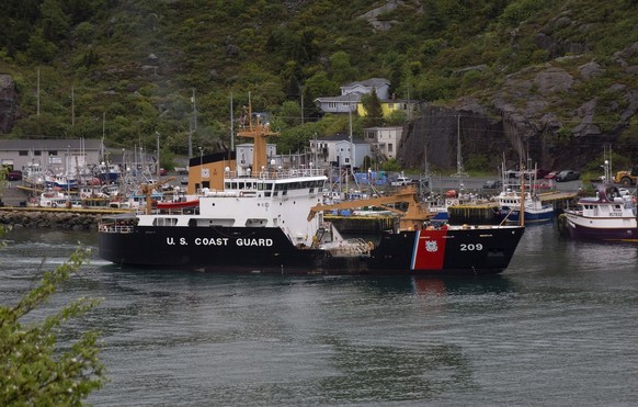 A U.S. Coast Guard ship arrives in the harbor of St. John's Newfoundland on Wednesday, June 28, 2023, following the arrival of the ship Horizon Arctic carrying debris from the Titan submersible. ...