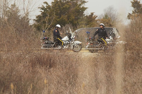 WANTAGH, NY - APRIL 11: Police sit on motorcycles near a crime scene where they found additional remains that have yet to be identified as human during a search on Jones Beach Island on April 11, 2011 ...