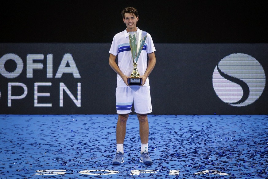 Switzerland&#039;s Marc-Andrea Huesler holds the trophy after winning the final match of the 2021 Sofia Open ATP 250 tennis tournament in Sofia, Bulgaria, Sunday, Oct, 2 2022. (AP Photo / Pavel Danev)