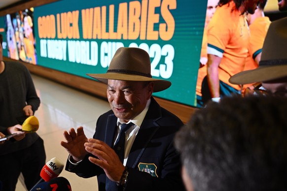 epa10803629 Wallabies coach Eddie Jones speaks to the media during a press conference as the team departs for the Rugby World Cup 2023 in France; at Sydney International Airport in Sydney, Australia,  ...