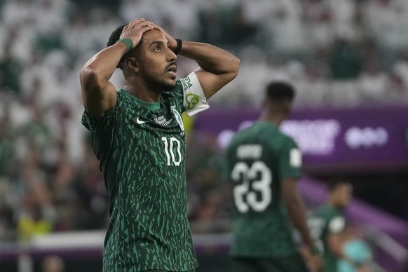 Saudi Arabia's Salem Al-Dawsari holds his head after missing a chance to score during the World Cup group C soccer match between Poland and Saudi Arabia, at the Education City Stadium in Al Rayyan , Q ...