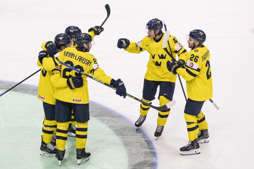 Swedish players Sweden's Erik Brannstrom and Ivar Stenberg, from right, celebrate after their goal to 2:2, during the 2026 IIHF Men's Ice Hockey World Championship preliminary round group B  ...