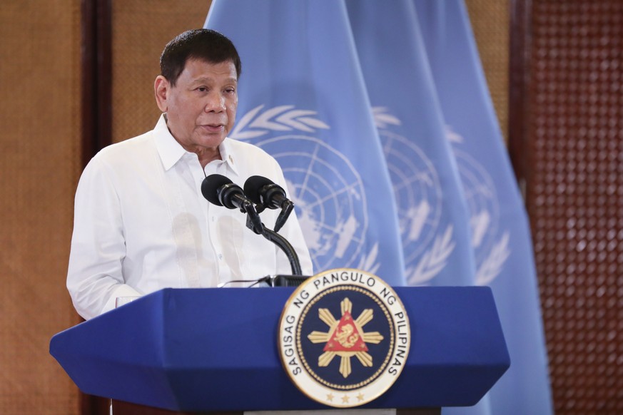 epa09481180 A handout photo made available by the Presidential Photographers Division (PPD) shows Filipino President Rodrigo Duterte speaking as he addresses virtually the 76th session of the United N ...