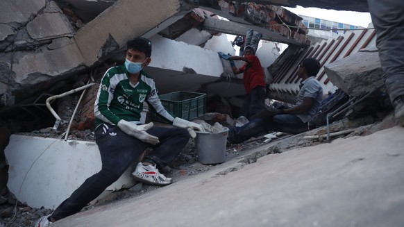 epa13160554 Rescue workers operate at the site of a collapsed building following an earthquake in Cali, Colombia, 10 August 2026. Colombian President Abelardo de la Espriella stated that the San Jose  ...