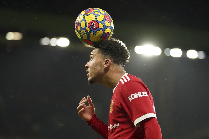 Manchester United's Jadon Sancho prepares to take a corner during the English Premier League soccer match between Manchester United and Arsenal at Old Trafford stadium in Manchester, England, Thursday ...