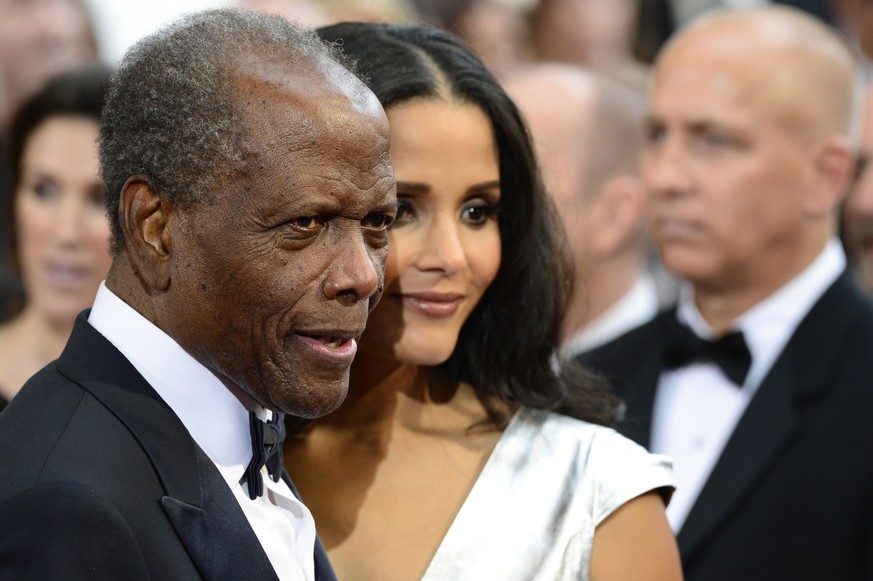 epa09672145 (FILE) - US actor, director Sidney Poitier (L) and daughter US actress Sydney Tamiia Poitier (R) arrive for the 86th annual Academy Awards ceremony at the Dolby Theatre in Hollywood, Calif ...