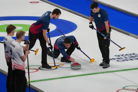 Czechia's Lukas Klima, Martin Jurik, and Lukas Klipa in action during the men's curling round robin session against Germany, at the 2026 Winter Olympics, in Cortina d'Ampezzo, Italy, Tu ...