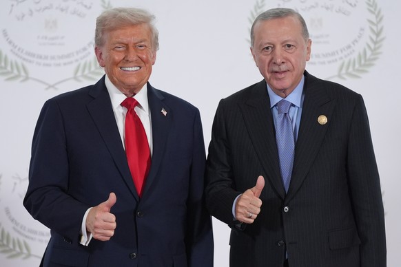 President Donald Trump greets Turkey's President Recep Tayyip Erdogan during a summit to support ending the more than two-year Israel-Hamas war in Gaza after a breakthrough ceasefire deal, Monday ...