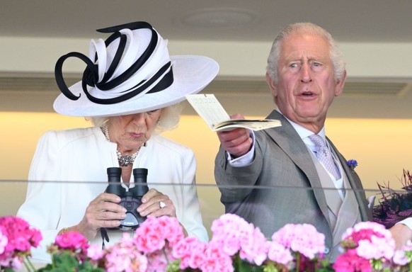 ASCOT, UNITED KINGDOM - JUNE 24: (EMBARGOED FOR PUBLICATION IN UK NEWSPAPERS UNTIL 24 HOURS AFTER CREATE DATE AND TIME) Queen Camilla, King Charles III and Lady Gabriella Windsor watch, from the Royal ...