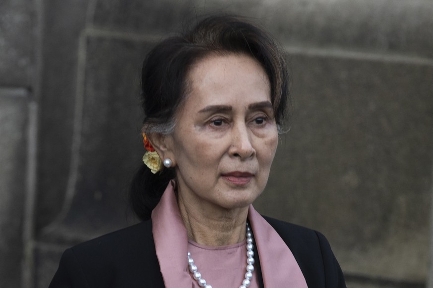 FILE - Myanmar&#039;s leader Aung San Suu Kyi leaves the International Court of Justice after the first day of three days of hearings in The Hague, Netherlands, on Dec. 10, 2019. A court in Myanmar on ...