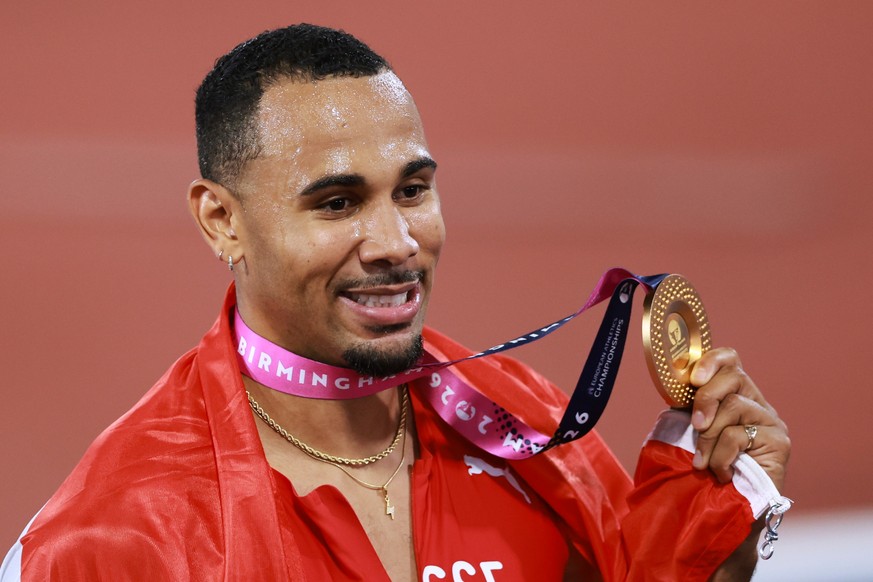 Switzerland's Jason Joseph poses with his gold medal after winning the men's 110 meters hurdles final at the European Athletics Championships in Birmingham, England, Wednesday, Aug. 12, 2026 ...
