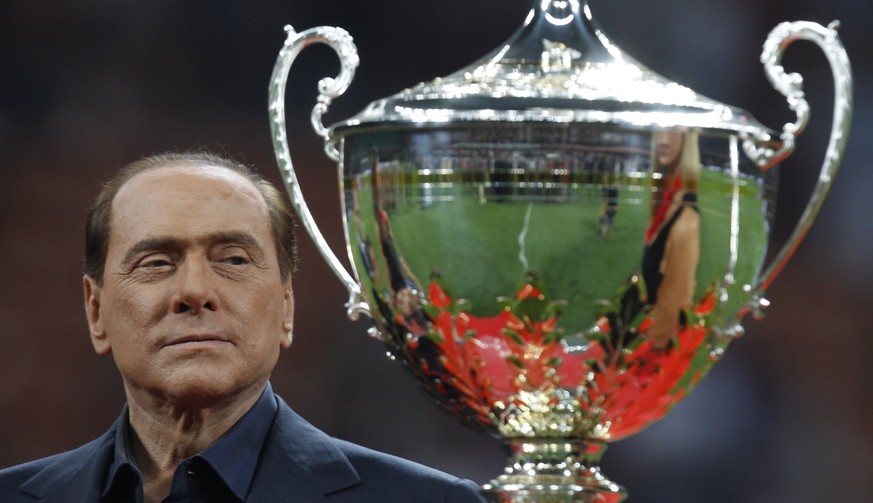FILE - Italian Premier Silvio Berlusconi attends the presentation of the &#039;Berlusconi trophy&#039; after a soccer match between AC Milan and Juventus at the San Siro stadium in Milan, Italy, Aug.  ...