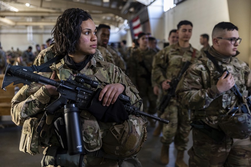 Members of the 82nd Airborne Division of the U.S. Army prepare for deployment to Poland from Fort Bragg, N.C. on Monday, Feb. 14, 2022. They are among soldiers the Department of Defense is sending in  ...