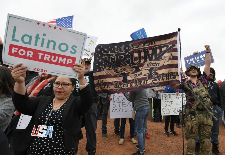 NORTH LAS VEGAS, NEVADA - NOVEMBER 07: Supporters of President Donald Trump protest outside the Clark County Election Department on November 7, 2020 in North Las Vegas, Nevada. Around the country, sup ...