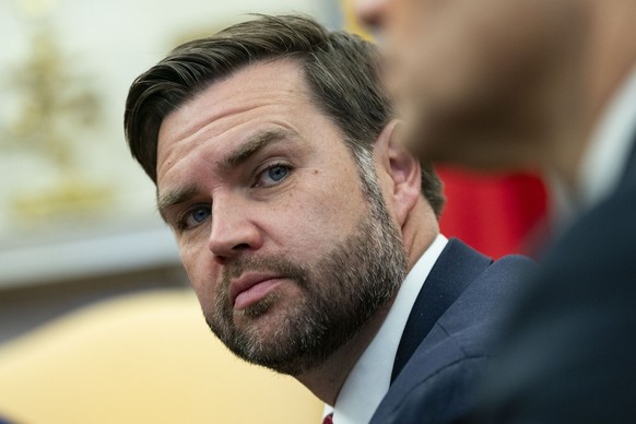 epa11922261 US Vice President JD Vance looks on while President Donald Trump meets with President of France Emmanuel Macron in the Oval Office at the White House in Washington, DC, USA, 24 February 20 ...